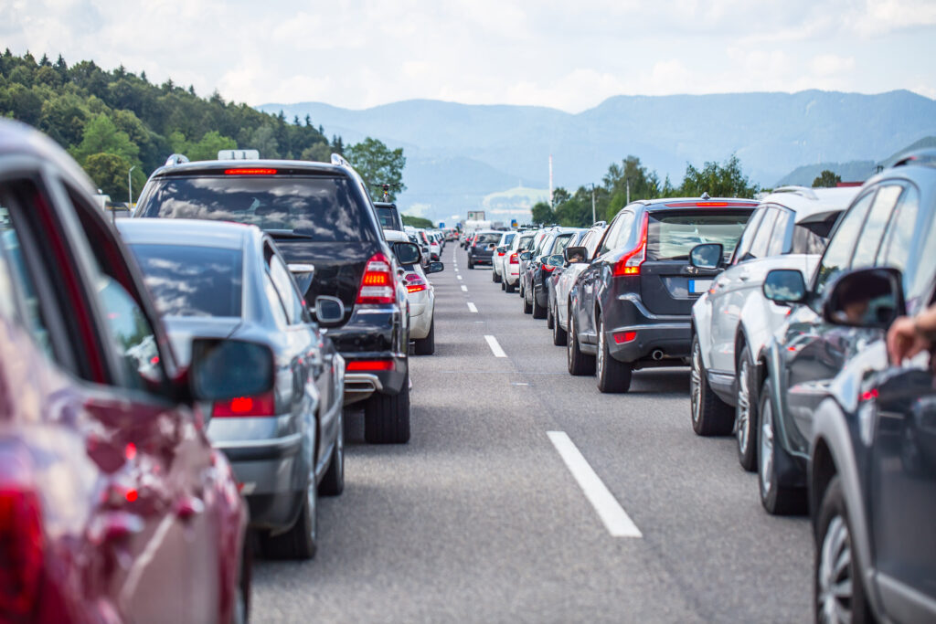 Traffic jam on the highway in the summer holiday period or in a traffic accident. Slow or bad traffic.