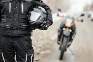 men riding motorcycle winter day.