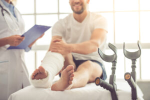 a person in a cast on a hospital bed